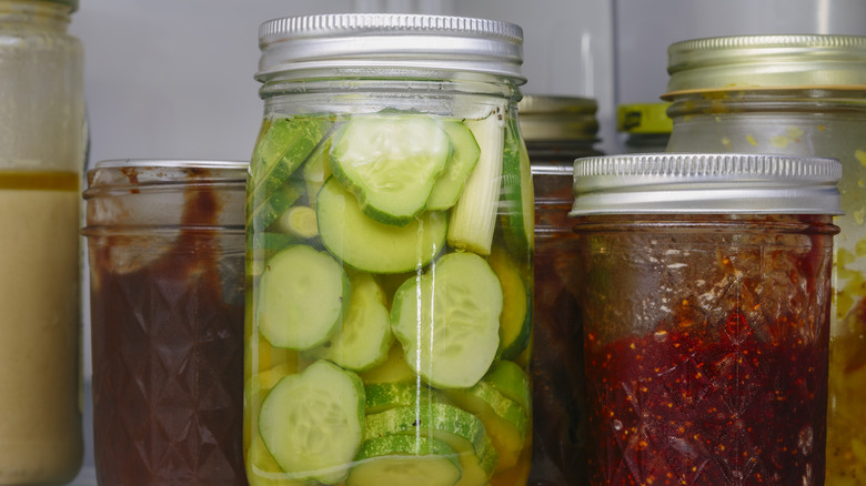 close up of pickles in refrigerator