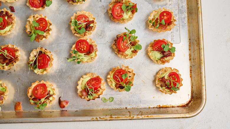 BLT phyllo cups topped with microgreens