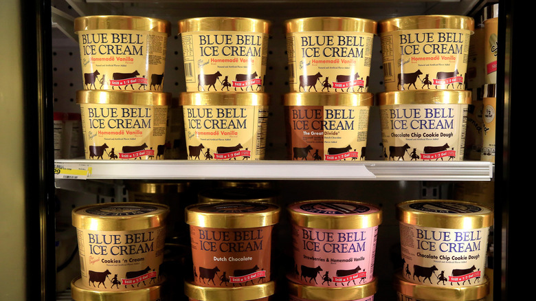 Blue Bell ice cream in a refrigerator case in a supermarket