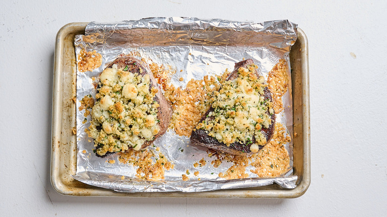 Baked steaks on a sheet tray