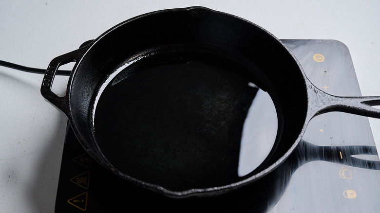 heating oil in a skillet
