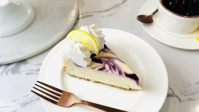 Slice of blueberry lemon cheesecake