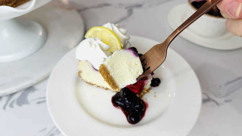 Slice of blueberry lemon cheesecake