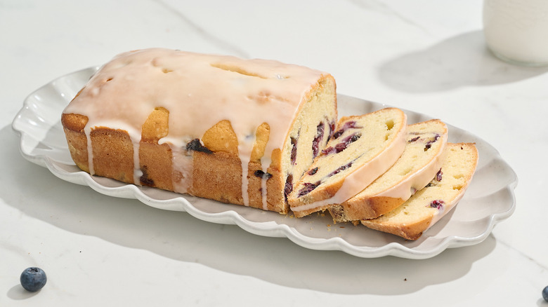 blueberry lemon pound cake sliced on a platter