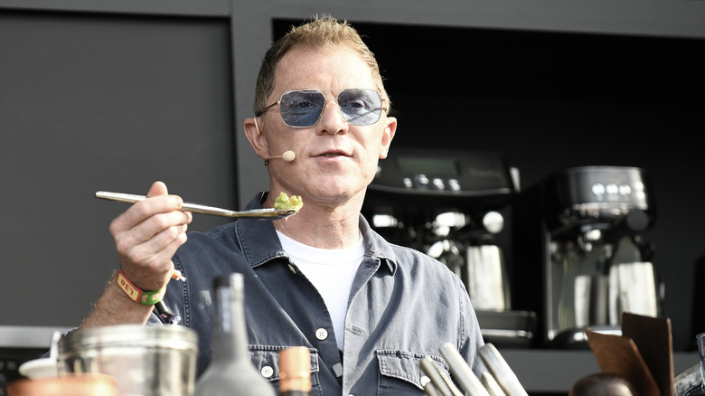 bobby flay holding a spoon