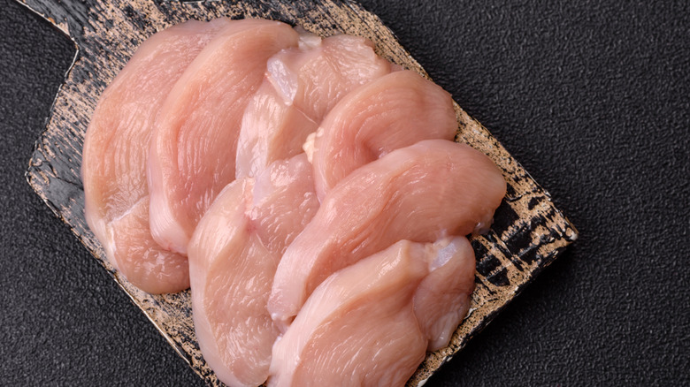 raw chicken on a cutting board