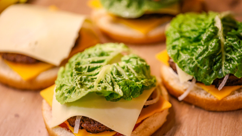 Assembled burgers with lettuce and cheese