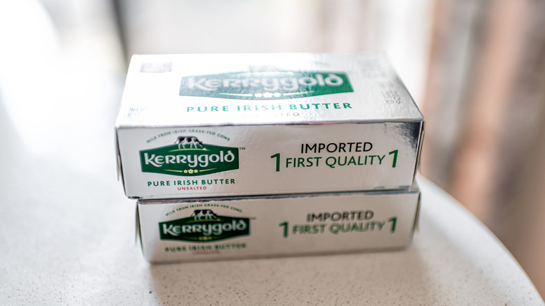 Two blocks of unsalted Kerrygold Irish butter stacked on top of each other on a table
