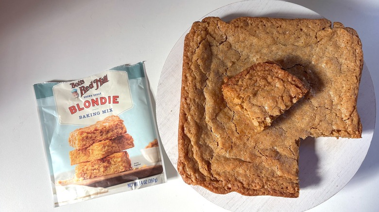Bob's Red Mill brown sugar blondie mix bag next to brown sugar blondies on white table