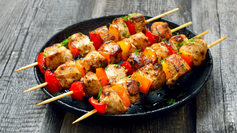 Marinated chicken kabobs on plate