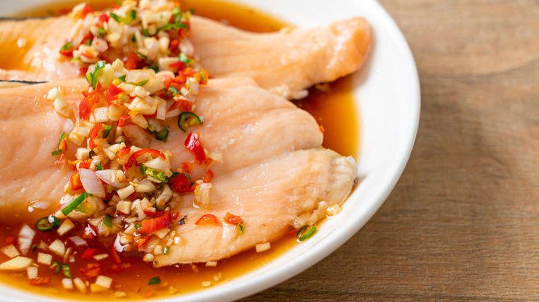 fish marinating in yuzu ponzu sauce