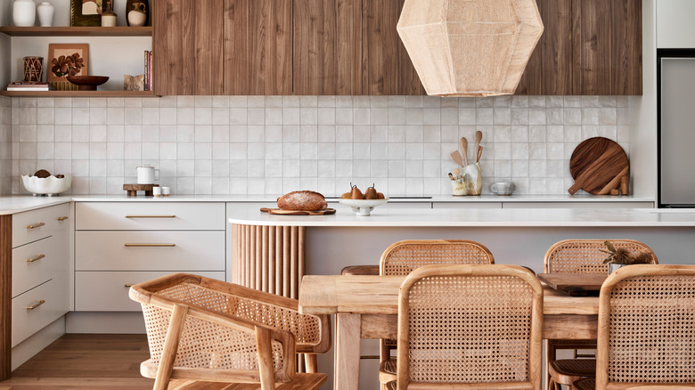modern coastal boho style kitchen and dining area with oak and rattan furniture