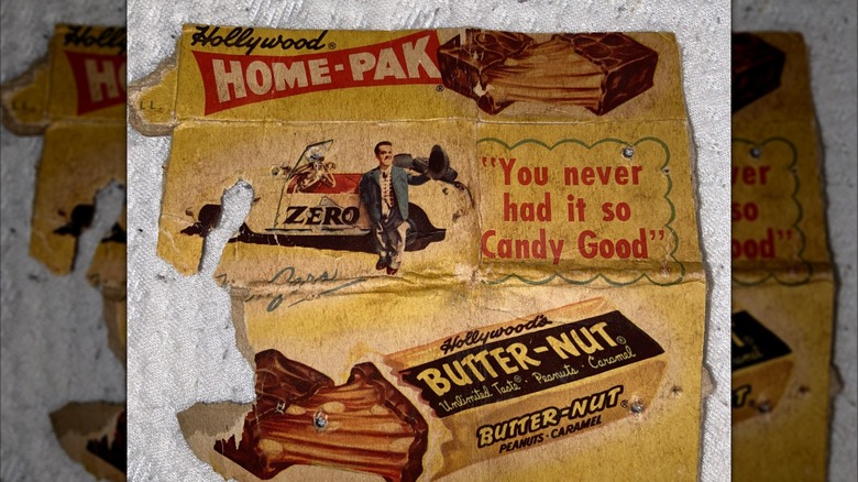 Mirrored image of old unfolded Butter-Nut candy bar packaging on white blanket