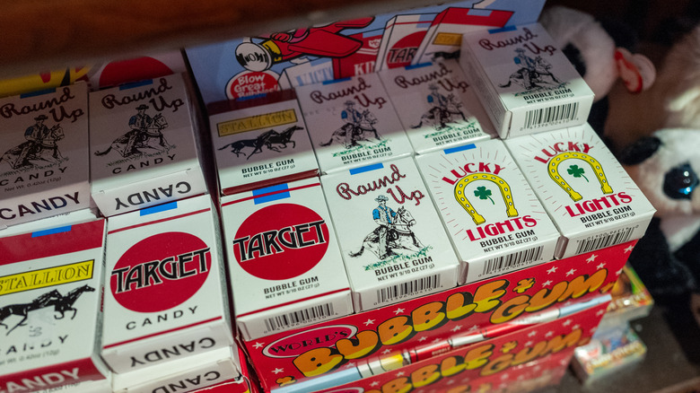 Close-up of containers of candy cigarettes for sale