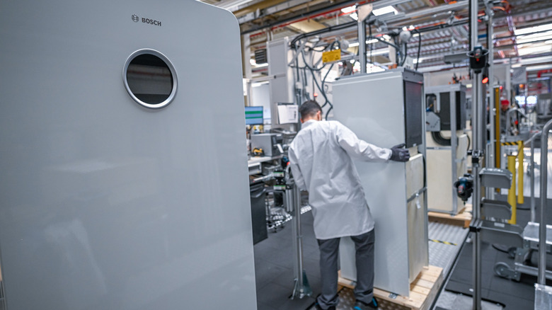 an employee works at a Bosch manufacturing plant