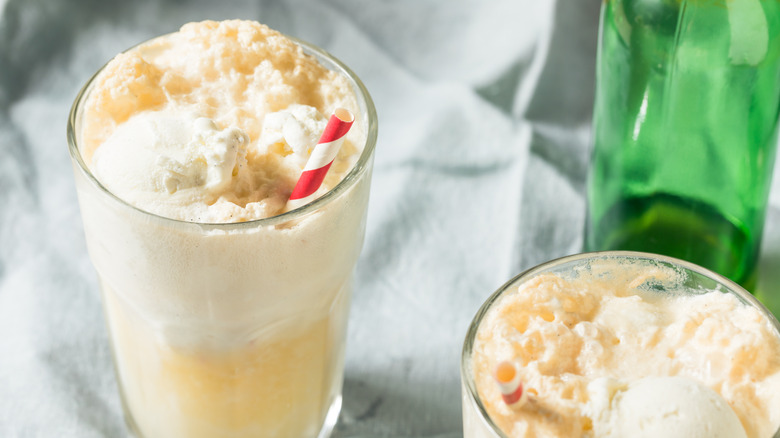 two Boston cooler milkshakes with a green bottle in the background