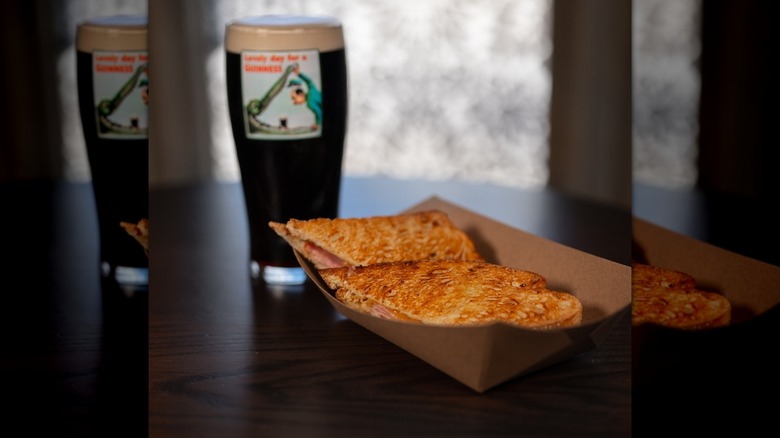 Irish toastie in the foreground and a pint of Guinness in the background