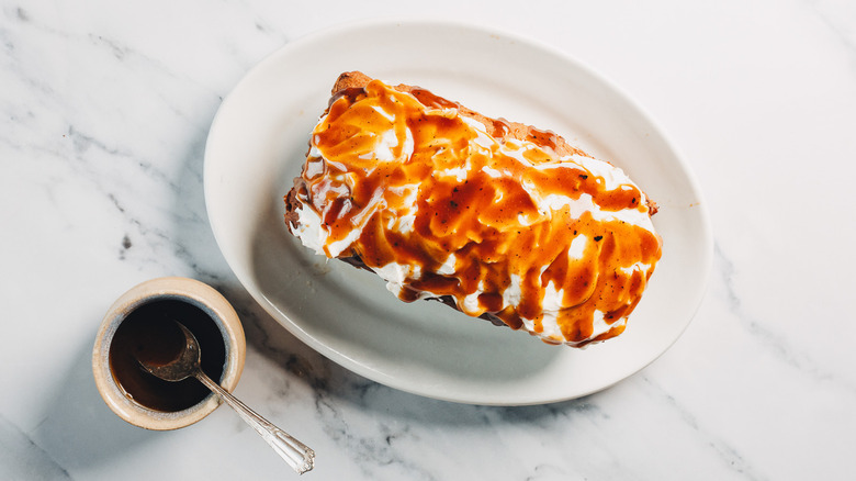 Overhead view of banana bread with caramel sauce.