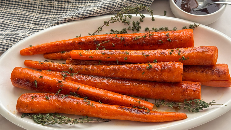 glazed carrots with herbs on serving platter