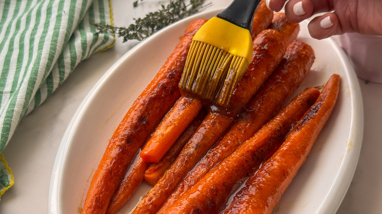 brushing carrots with glaze