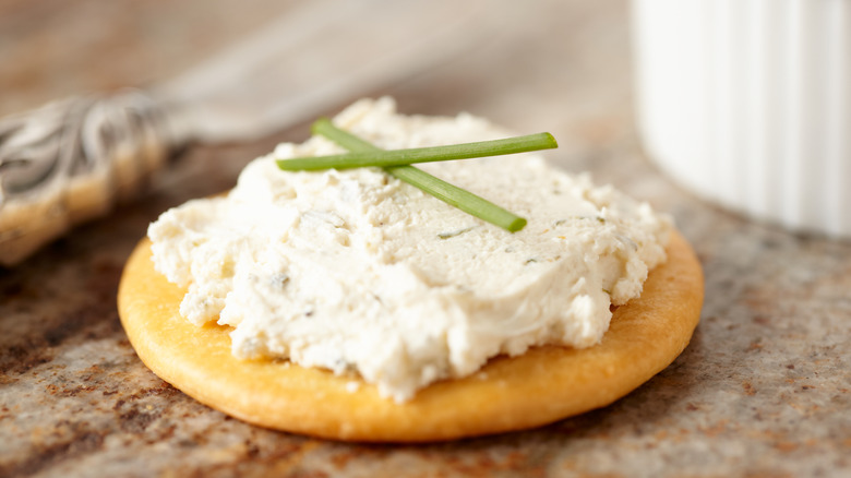 Boursin cheese on a cracker