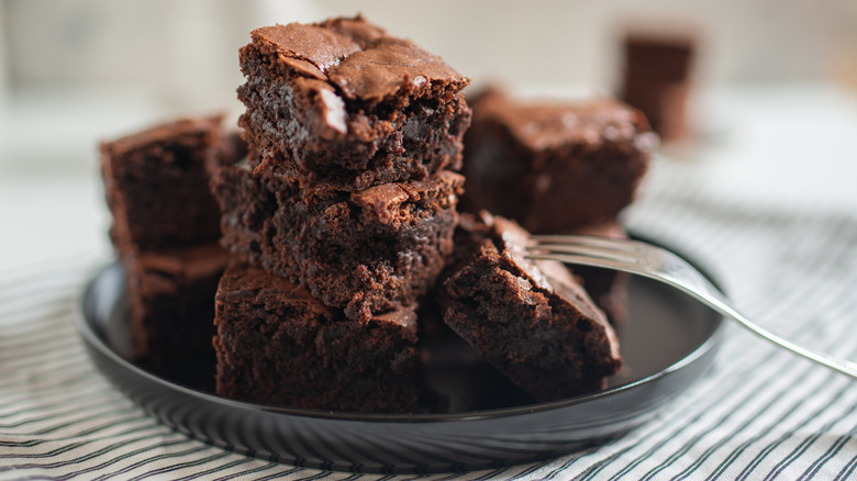 A stack of brownies on a plate