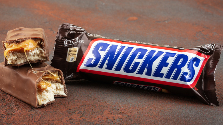 cross section of Snickers next to a wrapped bar