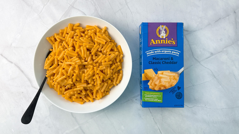 bowl of macaroni and cheese and box from Annie's