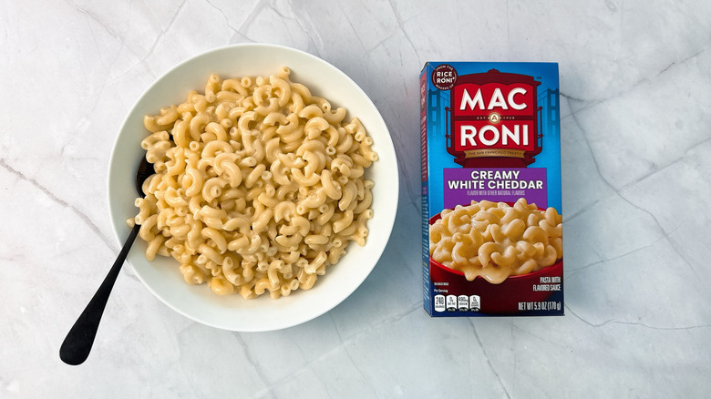 bowl of macaroni and cheese and box from mac A roni