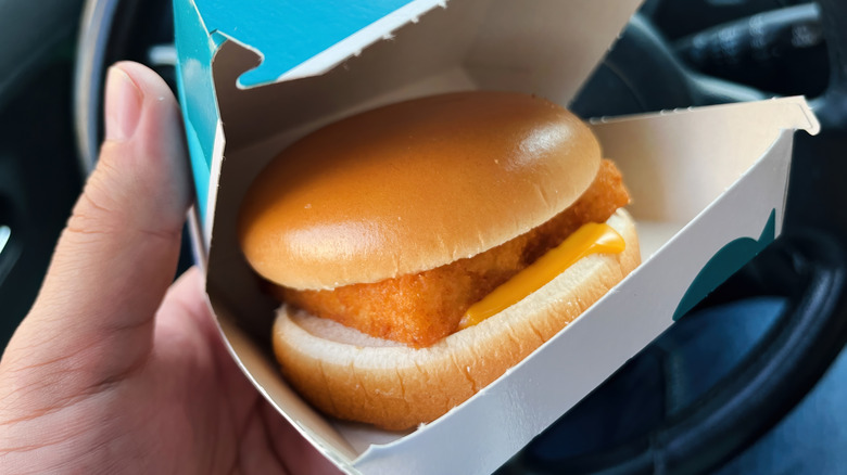Hand holding McDonald's Filet-O-Fish box