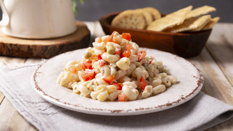 Tuna pasta salad on a table served on white plate