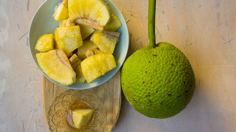 Breadfruit whole and sliced in a bowl