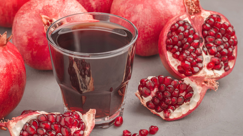 Pomegranates and a glass of juice
