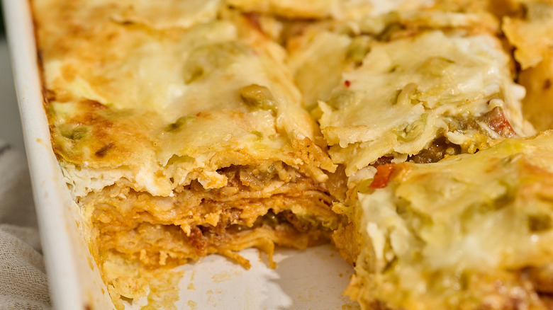 slices of breakfast burrito casserole in a casserole dish