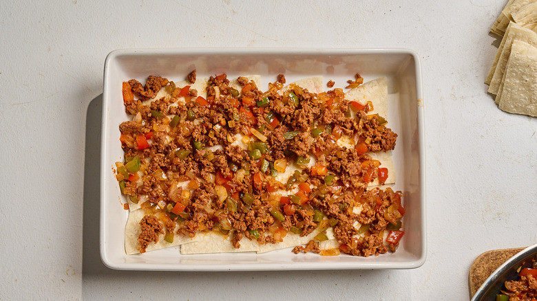chorizo spread into casserole dish