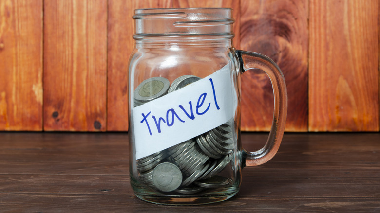 Coins in a glass mug