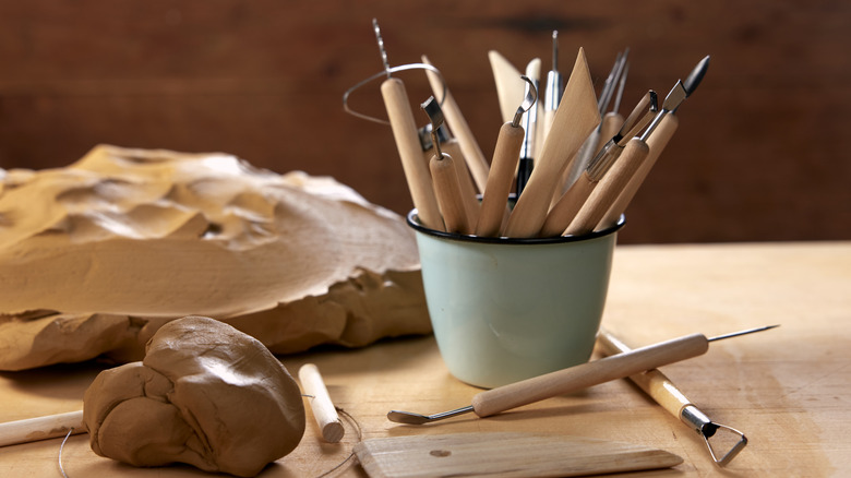 A mug holding crafting supplies