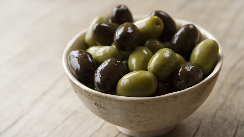 bowl of green and black olives