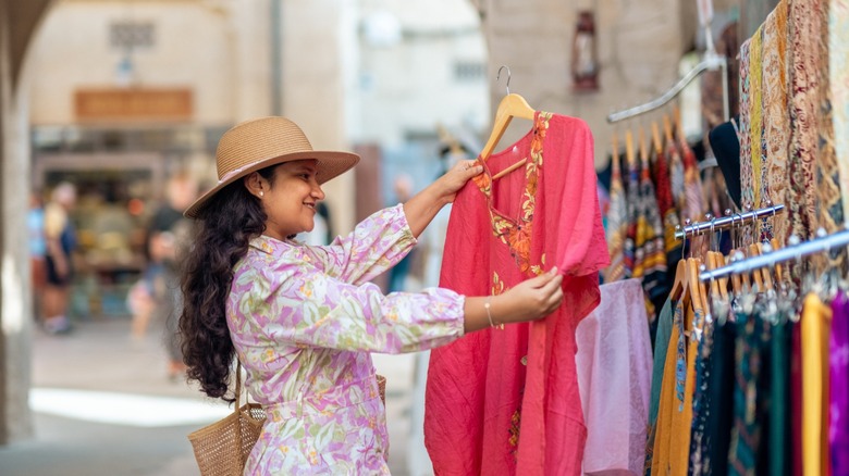 woman buying kaftan dress