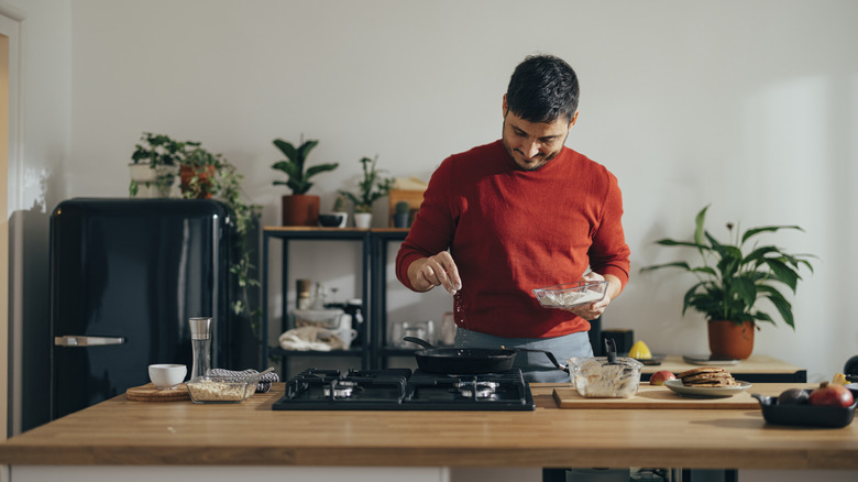 pierogi on a plate topped with herbs