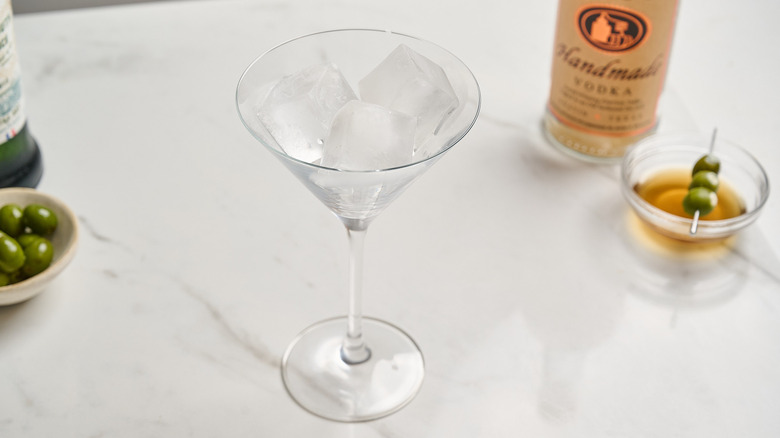 martini glass filled with ice cubes