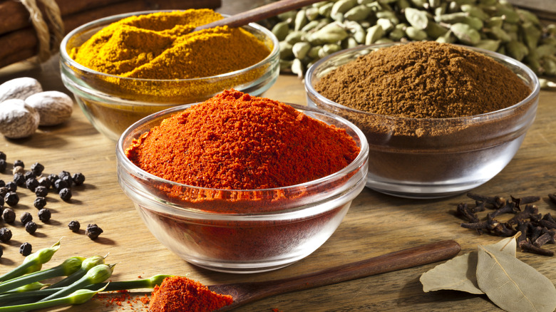 Cinnamon and spices in glass bowls