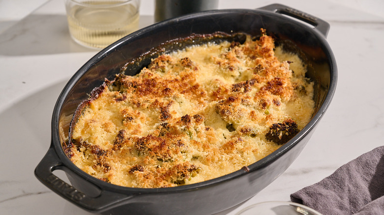 broccoli au gratin in a casserole dish on a table