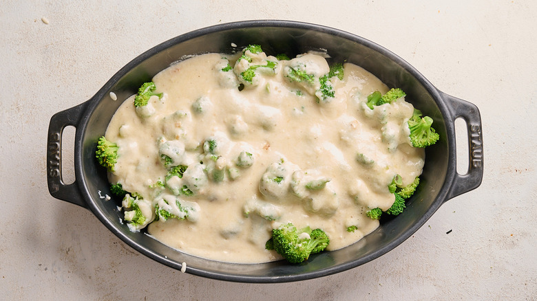 broccoli in a dish with cheese sauce