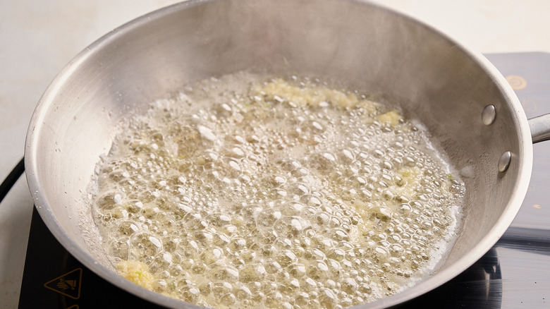 cooking garlic and butter in a skillet