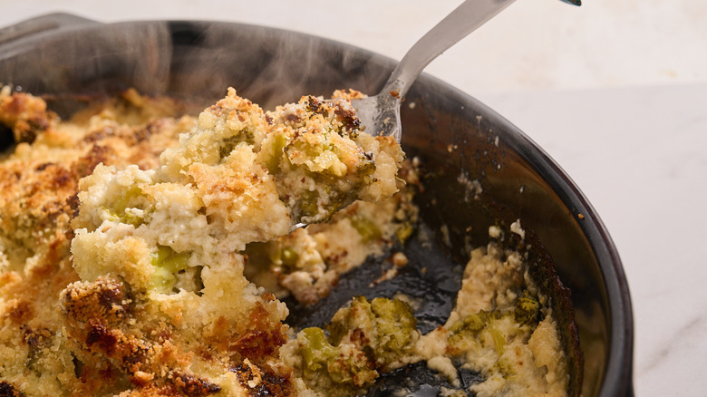 spoon scooping au gratin out of dish