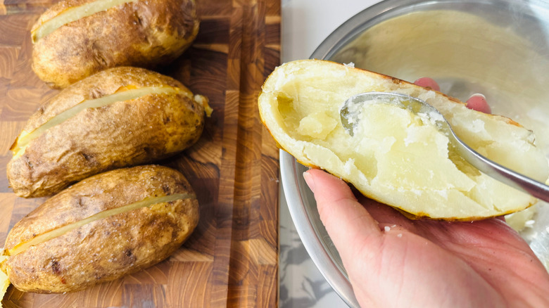 Spoon scooping out potato flesh