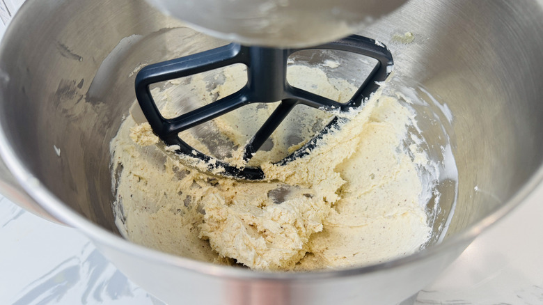 Brown butter cream cheese icing in mixing bowl