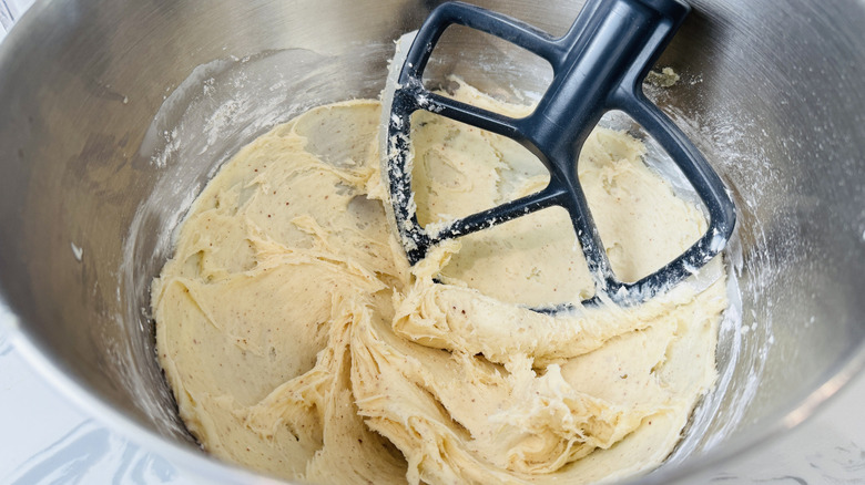 Brown butter cream cheese icing in mixing bowl