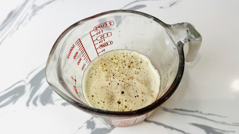 Brown butter in glass measuring cup